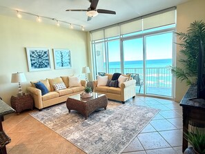 Large living room with 65" smart TV. 
