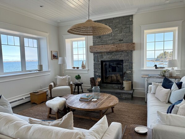 A masterpiece of comfort and design, ample seating, a fireplace and smart TV.