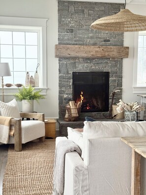 Cosy up by the fireplace during cooler months.