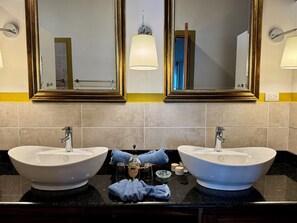 Very large bathroom with double sinks and walk in shower.