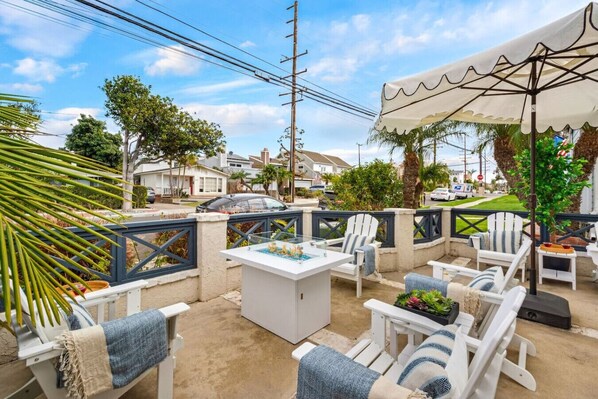 Relax in this stylish outdoor lounge with large umbrella.
