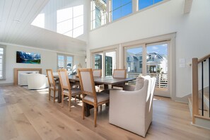 Dining area on second floor with soaring ceilings
