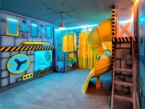 Kids' dream room with 3 Minion-themed twin beds, slide, custom murals, and more!