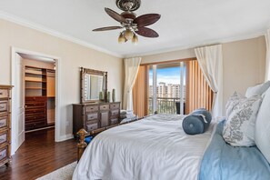 Primary bedroom space with a private balcony.