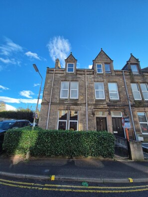 Townhouse - 3 floors. Parking is to the left of the building.