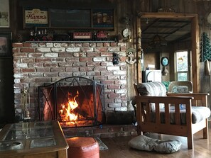 Living room fireplace and the sunroom beyond 