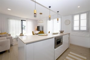 Modern and bright open kitchen fully equipped with quality appliances