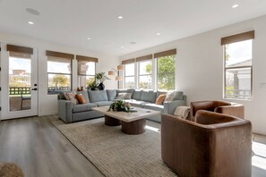 Living area with large sectional sofa, 2 chairs, and excellent views