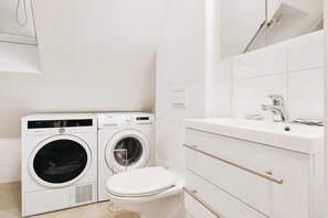 Compact laundry and bathroom combo.