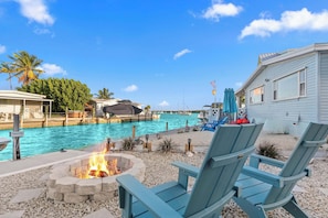 Gather around the fire pit after a day of adventures, amidst tropical vibes!