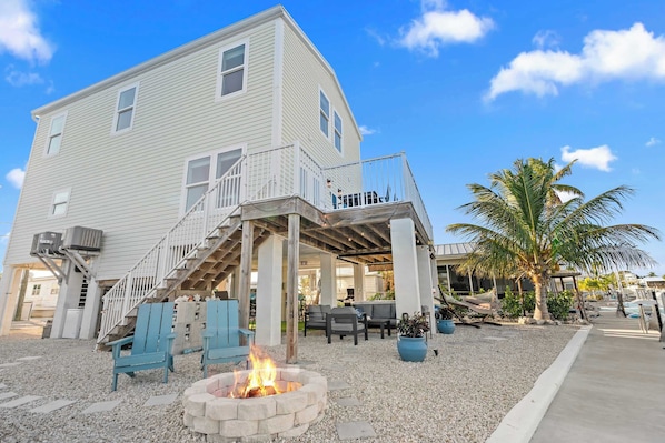 Gather around the fire pit after a day of adventures, amidst tropical vibes!
