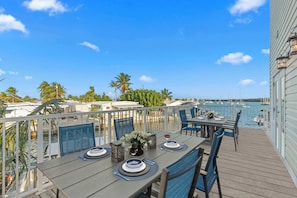 Savor fresh seafood on this spacious terrace with breathtaking water views!