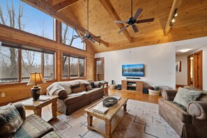 Great Room with Vaulted Ceilings, Plenty of Seating and Mounted TV