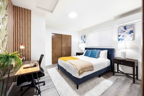 Here is another spacious bedroom with queen size bed and office desk
