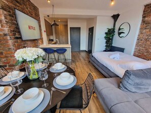 Our open-plan dining area is great for meals, games, or planning your next adventure together!
