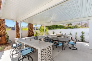 Don't miss this huge covered outdoor kitchen and dining pavilion