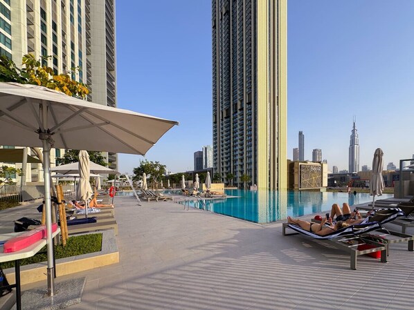 Stunning Rooftop Pool: Dive into luxury with panoramic skyline views and sun-soaked lounges!