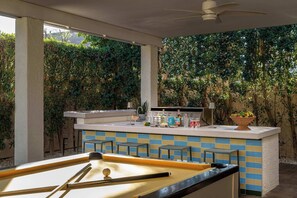 Billiards table and outdoor grilling area