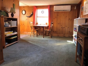 Game table at far end of living room.