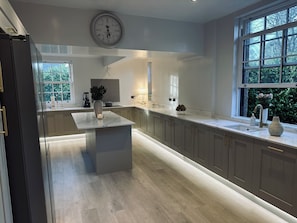 Large kitchen with central island and luxury quartz worktops