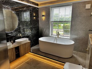 Master-Bathroom: Standalone Bath, Double Sink, Layered Lighting, Marble Features