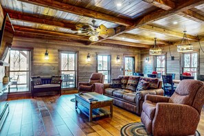 Living room with plenty of windows, offering natural light and beautiful views.