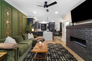 Relax on the couch in front of the fireplace. 