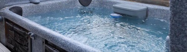 Relax after a day of adventure in the hot tub!