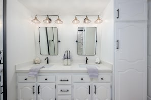 Updated bathroom with dual vanity.
