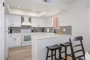 Fresh, bright and clean fully stocked kitchen