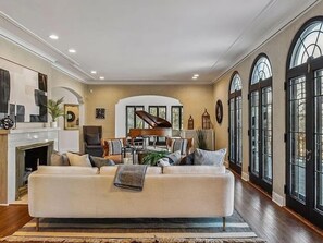 Stunning Main floor living room with gas fireplace, huge full furnished summer deck overlooking lake