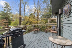 Private deck with serene wood views, relaxing dining outdoors