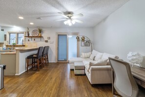 Bright, cozy living room with sofa bed, perfect for lounging or sleeping.