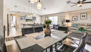 Step into sophisticated dining with this modern home, featuring an elegant dining area designed for unforgettable gatherings.