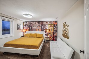 The speaker room has a king memory foam bed and the retro couch folds down.