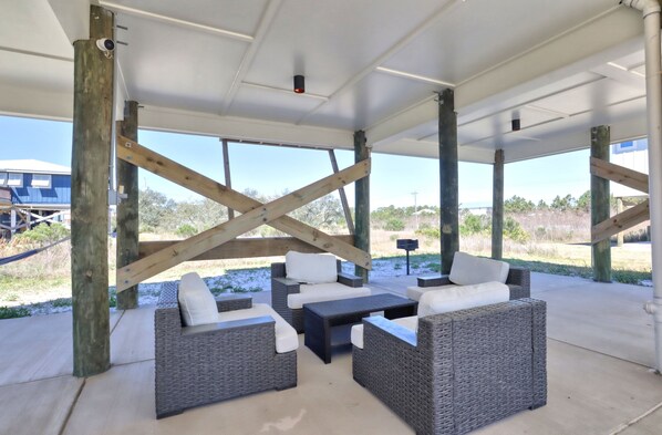 Buchanan Court, Ft Morgan Alabama. Outdoor seating. 4 bedrooms 3 bathrooms. Sleeps 12. Ft. Morgan, Alabama. Property Managed by Island Rentals