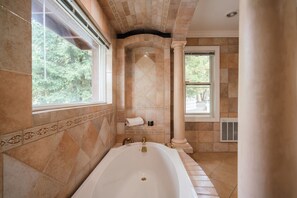 Timeless elegance meets modern comfort in this serene bath oasis.