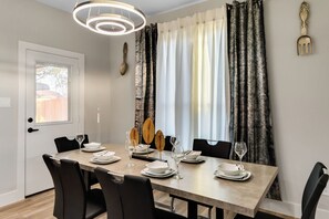 Dining area with plenty of seating and dining wares.