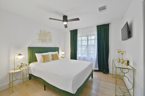 Bright and welcoming, the second bedroom features a comfortable queen bed, closet space,  hangers, and a smart TV. It is ideal for guests who need a quiet place to recharge and has easy access to a shared bathroom.