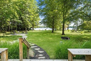 Take in the large front yard ready for a round of croquet or game of kickball. Savor the tree-filled lake view from the large, front lake-facing deck of the Upper Scott Lake Retreat