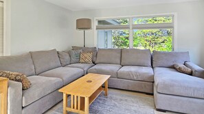 Second floor living room with comfortable sectional and flat screen TV