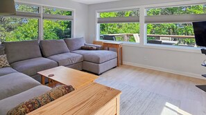 Second floor living room with comfortable sectional and flat screen TV