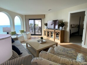 Living Room with Stunning Views of Beach and Pool