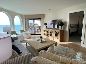 Living Room with Stunning Views of Beach and Pool