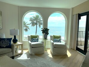 Living Room with Stunning Views of Beach and Pool