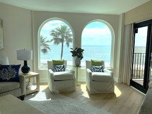 Living Room with Stunning Views of Beach and Pool