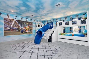 Sky-Themed Kids' Room with Slide and Bunk Beds