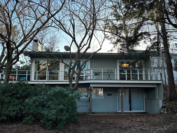 Front view of the house showing wraparound deck perfect for relaxing!