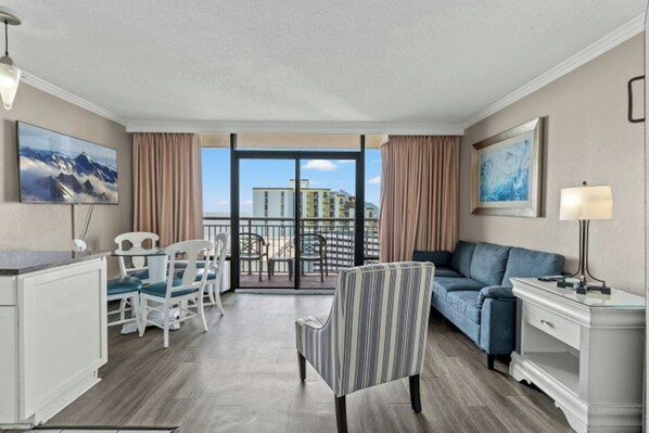 The private balcony off the living room invites you to step outdoors.