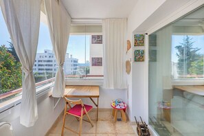 Glassed Balcony: With armchairs, a small table, and a desk. Private and cozy. (2)